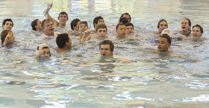 It’s a tradition for the winning team’s players and coaches to jump in the pool in a moment of celebration. Photo By Michael Alexander