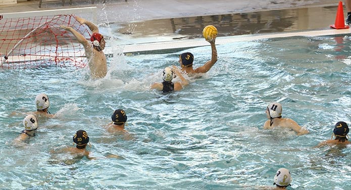St. Pius X goalkeeper Andres Garcia, top left, unsuccessfully attempts to block an opponent’s shot. It turned out to be the only goal by the Wildcats, coming with 6:22 left in the fourth and final period. Photo By Michael Alexander
