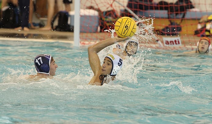 St. Pius sophomore Myles Williams (#5) looks to pass to one of his teammates during the semifinal match against the Blue Devils of Norcross. Williams, who scored two goals, prides himself on good defense when he’s not scoring for the team. Photo By Michael Alexander