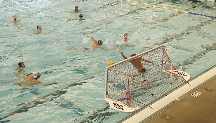 St. Pius X’s Jordan Chatfield, right center, scores the team’s 10th goal with 18 seconds left in the third period. Photo By Michael Alexander