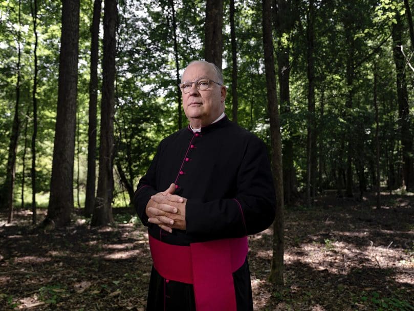 Msgr. Daniel Stack, pastor of St. Thomas Aquinas Church in Alpharetta, retired this month. He is photographed on the grounds of the parish during the 50th anniversary celebration June 4. Photo by Johnathon Kelso