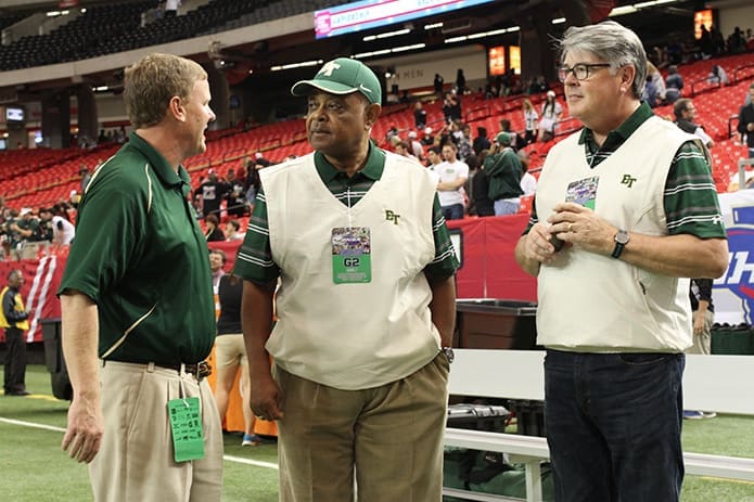 (L-r) Blessed Trinity High School athletic director Ricky Turner, Archbishop Wilton D. Gregory and Archdiocese of Atlanta chancellor Deacon Dennis Dorner converse before the kickoff of the Dec. 11 Class AAA state football championship. It was Blessed Trinity's first appearance in the state finals at the Georgia Dome, Atlanta. Photo By Michael Alexander