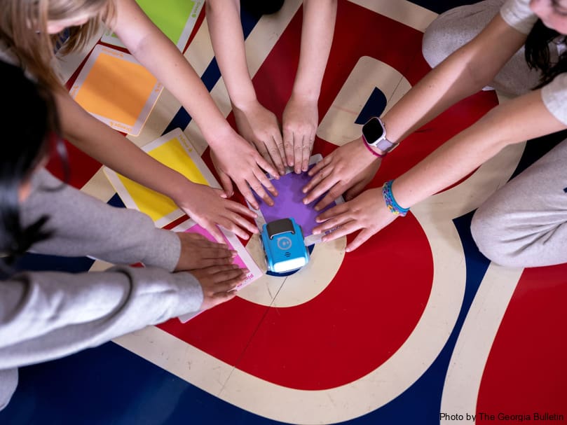 Second-grade students work on an indi coding car project during a Stem Showcase held at St. Mary's Academy. Photo by Johnathon Kelso