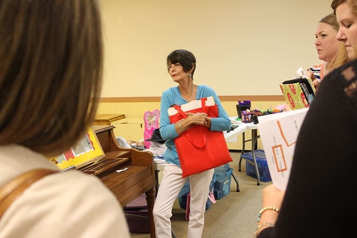 At the conclusion of her workshop on tested and proven ideas for keeping toddlers and two-year-olds engaged, presenter Linda Buisson, center, takes some additional questions from attendees. Buisson is the director and teacher of two-year-olds at the St. George Church preschool in Newnan. Photo By Michael Alexander
