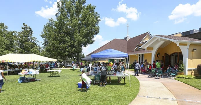 Hundreds of people braved the August heat to sample dishes from Africa, Asia, Central America, Europe and South America, play games and try their hand at karaoke during the Taste of St. John Vianney Church in Lithia Springs. Photo By Michael Alexander
