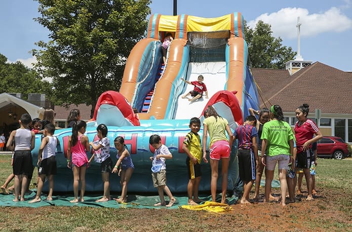The Big Kahuna water slide was the biggest attraction among the parish children on a day that topped out around 95 degrees. Photo By Michael Alexander