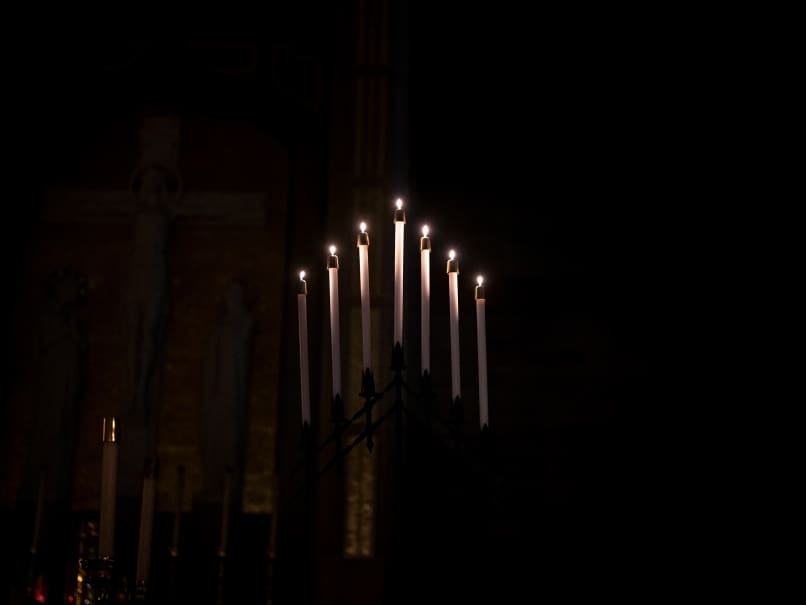 Candles illuminate the Cathedral of Christ the King at the beginning of the Tenebrae service. Photo by Johnathon Kelso