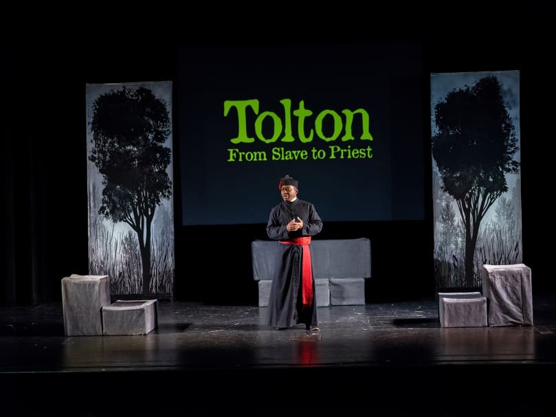 Jim Coleman speaks to the students of St. Mary's Academy after his performance of "Tolton: From Slave to Priest." Photo by Johnathon Kelso