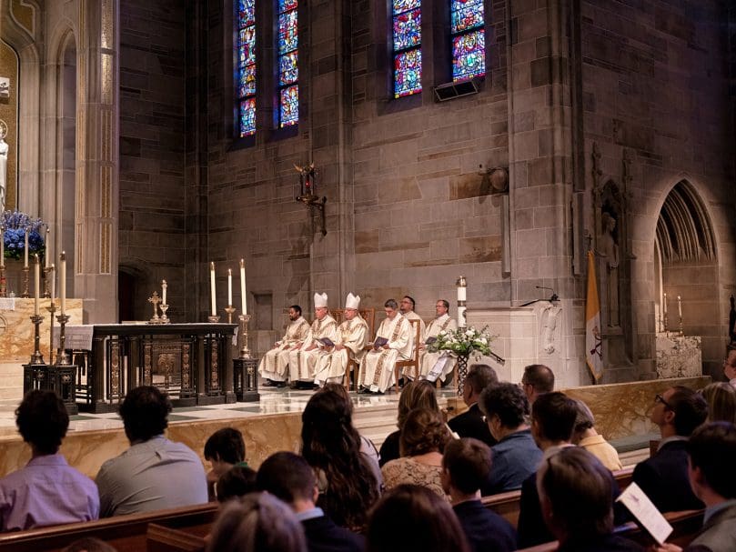 Clergy members listen to the first reading during the Rite of Ordination to the transitional diaconate held at the Cathedral of Christ the King May 21. Photo by Johnathon Kelso