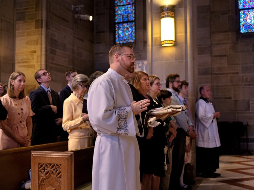 Evan Glowzinski is seen with with his family during the Rite of Ordination to the transitional diaconate at the Cathedral of Christ the King in Atlanta. He will serve at St. Michael Church in Gainesville for the next year. Photo by Johnathon Kelso