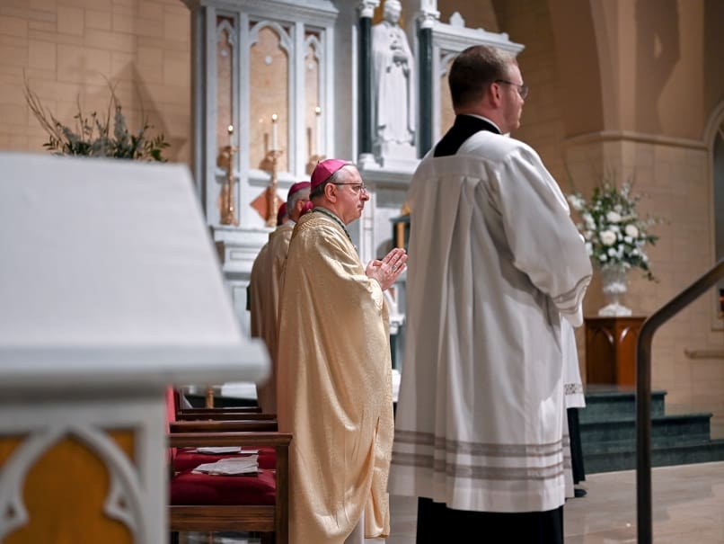 Bishop Joel M. Konzen, SM, prays with the faithful during the transitional diaconate ordination at St. Peter Chanel Church. Photo by Johnathon Kelso