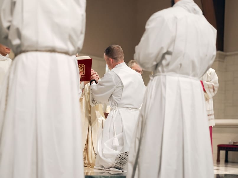 Colin Patrick makes a promise of obedience during to Archbishop Gregory Hartmayer, OFM Conv., as part of the ordination to the transitional diaconate. Five were ordained deacons May 20 in their journey to the priesthood. Photo by Johnathon Kelso