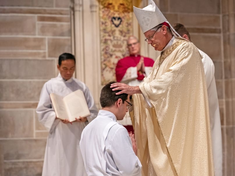 Bishop Bernard E.  Shlesinger III lays hands on Deacon Pete Coppola during ordination to the transitional diaconate. Photo by Johnathon Kelso