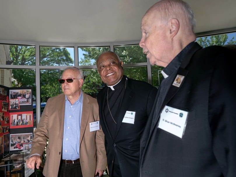 Cardinal Wilton Gregory, center, visits with Father Brian McWeeney, right, and Rabbi Wayne Franklin, left, at the Lyke House in Atlanta during the Consultation of Representatives of the National Council of Synagogues and the U.S. Conference of Catholic Bishops. Photo by Johnathon Kelso