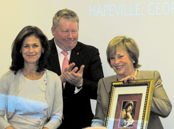 Kim Hanna, co-chair of the “Life Is Beautiful” gala, left, Butch Emgren, a member of the Order of Malta Auxiliary, and Diane Festa, right, Hospitaller of the Atlanta region of the Order of Malta, accept the Celebrate Life Award, in recognition of the Order of Malta’s contribution to the Advice and Aid Pregnancy Problem Center in Hapeville.