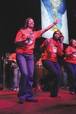 A music group from St. John Neumann Church, Lilburn, leads the praise and worship in the Spanish track.