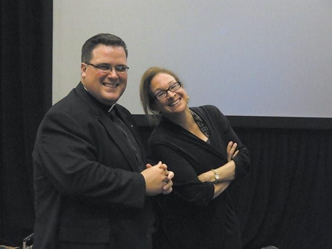 Father Joshua Allen, parochial vicar at St. Brigid Church, Johns Creek, poses for a photo with Elizabeth Lev, Ph.D., who was the main speaker for Revive.