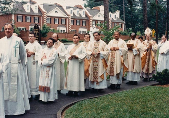 Rev. Mr. David Talley, fifth from left, waits for his ordination Mass at the Cathedral of Christ the King, Atlanta, to begin. Atlanta Archbishop Eugene Marino, SSJ, ordained him on June 3, 1989.