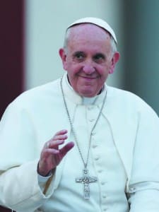 Pope Francis waves as he leaves a Pentecost prayer vigil with members of Catholic lay movements in St. Peter’s Square at the Vatican May 18. An estimated 200,000 people from 150 movements attended the vigil.