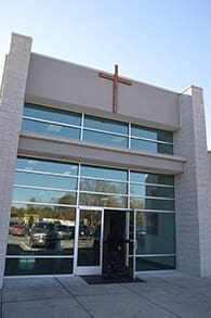 The mission has transformed a car dealership into worship space with the assistance of the archdiocese.