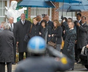 Mourners watch as the casket of 26-year-old Massachusetts Institute of Technology police officer Sean Collier is carried into St. Patrick’s Church for his funeral Mass in Stoneham, Mass., April 23. Officer Collier was allegedly killed by the brothers accused of the Boston Marathon bombings. Two explosions hit the marathon April 15, killing three people and injuring more than 200 others. 