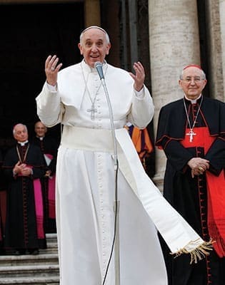 Pope Francis greets the crowd outside after praying the rosary at the Basilica of St. Mary Major in Rome May 4. The pope led the crowd in chanting “Viva la Madonna” (Long live the mother of God). At right is Cardinal Agostino Vallini, papal vicar for Rome.