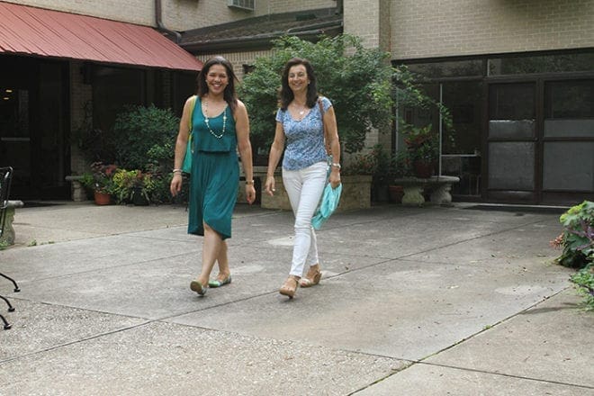 Shirley Aljure of Colombia, left, and Immaculada Romero-Fernandez of Spain leave Villa International Atlanta on their way to work at the Centers for Disease Control and Prevention (CDC). The international residents they host take on a variety of roles such as students, researchers, interning doctors, public health professionals and seminarians. (Photo By Michael Alexander)
