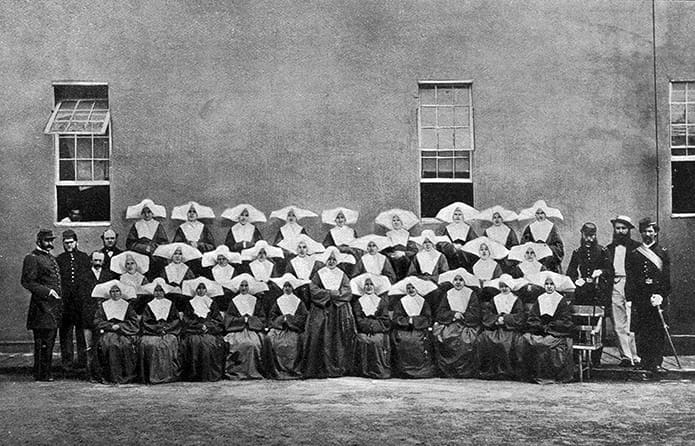 Members of the Daughters of Charity, who served as nurses, pose in an undated photo with Civil War soldiers outside Satterlee Hospital, a military hospital in West Philadelphia. Although built for 4,500 beds, the hospital had to care for more than 6,000 wounded soldiers, many housed in tents, in the months following the Battle of Gettysburg, Pa.