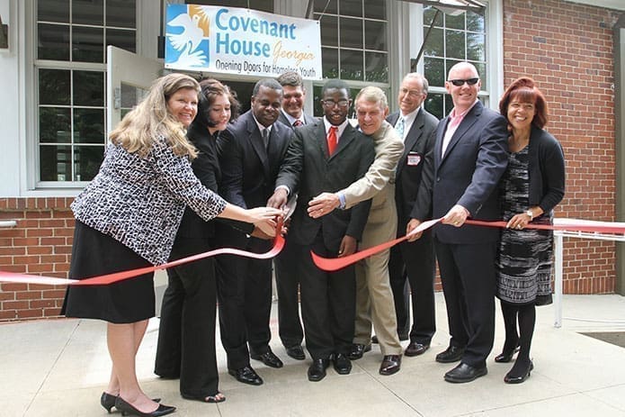 (L-r) Covenant House Georgia executive director Allison Ashe, Covenant House youth Emily Batson, Atlanta Mayor Kasim Reed, Covenant House Georgia board member Clark Dean, Covenant House youth Tyrone Alexander, Senior Pastor of Peachtree Presbyterian Church Dr. Vic Pentz, Covenant House board chair John Ridall, Covenant House president and CEO Kevin Ryan and Covenant House International executive vice president of administration Diane S. Milan conduct the celebratory ribbon cutting, May 30.