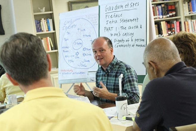 Dr. Matthew Bagot, center, an assistant professor at Spring Hill College, Mobile, Ala., leads a weekend retreat entitled “Church/World, Church/State: The Social and Political Vision of Vatican II.” The retreat, one of the Fortnight For Freedom educational opportunities around the Archdiocese of Atlanta, took place at Ignatius House, Atlanta, June 21-23.