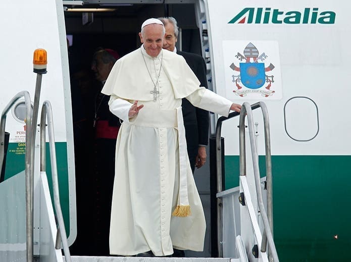 Pope Francis waves upon arrival at the international airport in Rio de Janeiro July 22. The pope is making his first trip outside Italy to attend World Youth Day, the international Catholic youth gathering.