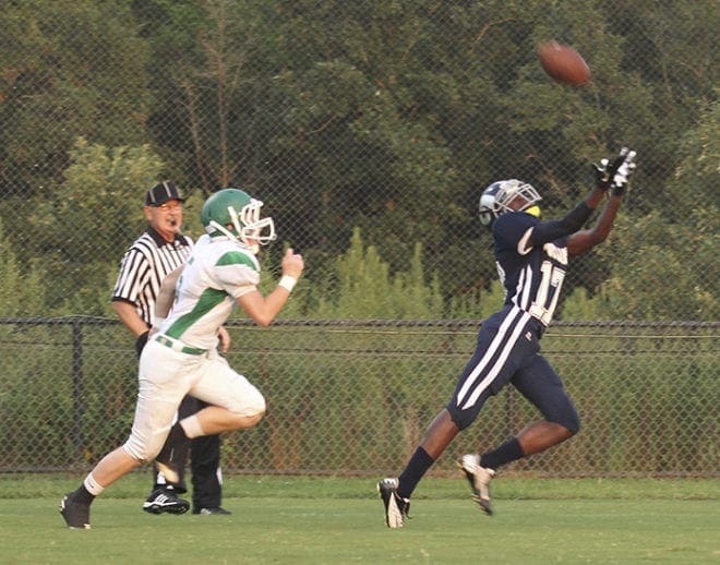 Monsignor Donovan junior wide receiver Michael Ohana outruns defensive back Dalton Shellnut for a 35-yard catch and the team’s second first-quarter touchdown. Monsignor Donovan recorded its first victory by defeating Nathanael Greene Academy 44-26.