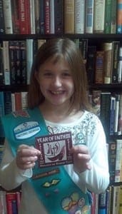 Girl Scout Laura Rebello of Hoschton displays her Year of Faith badge. She is the first Scout in Georgia to receive the badge.