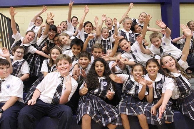 The fifth-graders, like a majority of the student body, were filled with excitement preceding and after the announcement made by principal and Dominican Sister Mary Patrick on Sept. 24. At approximately 2:45 p.m. she informed the students and staff that St. Catherine of Siena was one of 286 schools across the country recognized as a 2013 National Blue Ribbon School. Photo By Michael Alexander