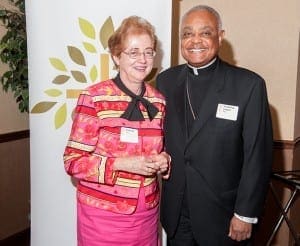A retired University of Georgia professor, Diane Kohl worked with the Catholic Foundation to set up a charitable gift annuity for her parish, St. Joseph Church, Athens. At the Sept. 28 Mass, she received a Deo Gratias pin from Archbishop Wilton D. Gregory. Photo By Gibbs Frazeur