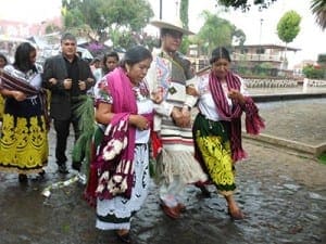 Accompanied by women from the community, family, friends and musicians, Father Luis Simon Gallardo is escorted from his family’s home to the church, San Andres Tzirondaro, where he will celebrate his first Mass.