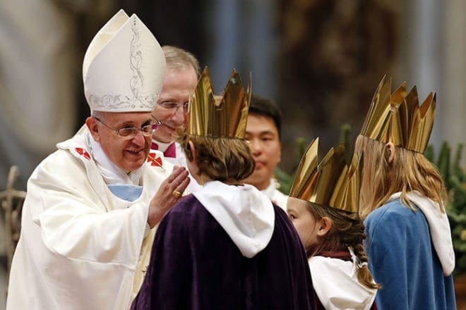 Children bring Pope Francis a chalice during the offertory as he celebrates Mass in the Vatican's St. Peter's Basilica on the feast of Mary, Mother of God, Jan. 1. CNS photo/Giampiero Sposito, Reuters
