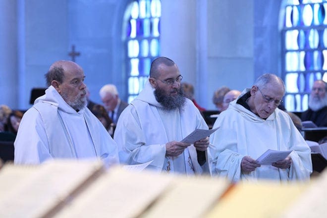 Cistercian monks (l-r) Father James Behrens, Father Gerard Gross and Brother Elias Marechal sing the responsorial psalm during the Jan. 13 Mass of Christian Burial for Father Luke Kot. Photo By Michael Alexander