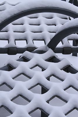 Snow covers the patio furniture at the Atlanta Archdiocese Chancery in Smyrna. A Jan. 28 winter storm of snow and ice created great havoc for the city of Atlanta and its surrounding suburbs. Photo By Michael Alexander