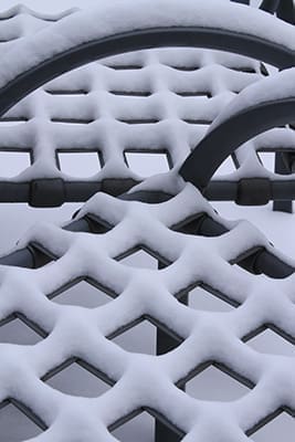 Snow covers the patio furniture at the Atlanta Archdiocese Chancery in Smyrna. A Jan. 28 winter storm of snow and ice created great havoc for the city of Atlanta and its surrounding suburbs. Photo By Michael Alexander 