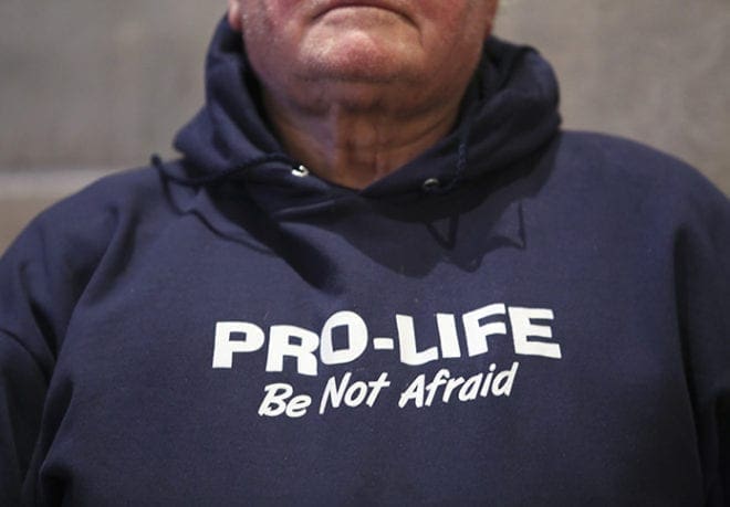 Joseph Peek of Immaculate Heart of Mary Church, Atlanta, professes his pro-life position with the words across his sweatshirt. Photo By Michael Alexander