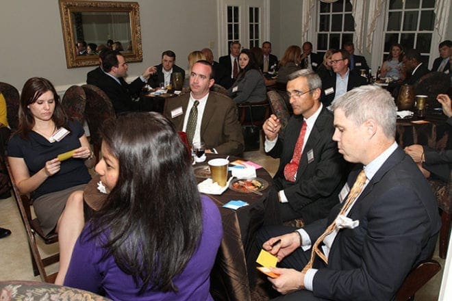 A reception for the 2011 Catholic Charities Leadership Class takes place at the archbishop's residence on West Wesley Road. Photo By Michael Alexander