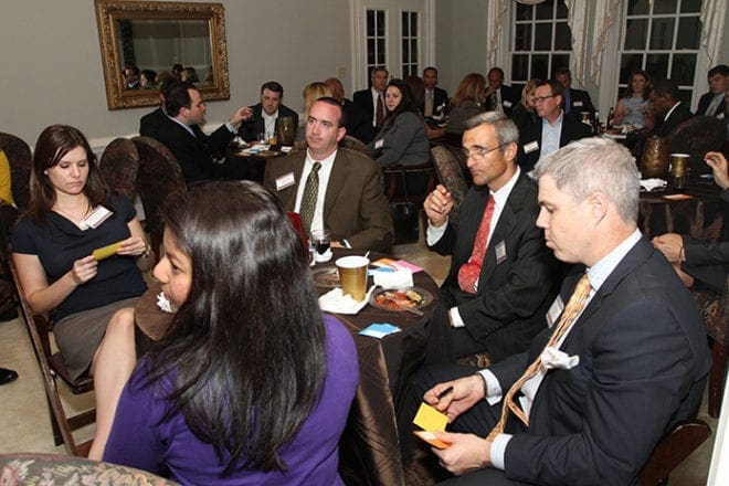 A reception for the 2011 Catholic Charities Leadership Class takes place at the archbishop's residence on West Wesley Road. Photo By Michael Alexander 