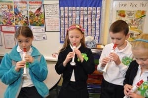 Visitors at Grandparent and Special Others’ Day at Our Lady of the Assumption School, Atlanta, were treated to Irish fare and student performances. The third-grade flute players, left to right, Gigi Glennon, Sabrina Boyd, Liam O’Toole and Caroline Baljet, play some favorite tunes on the instruments.