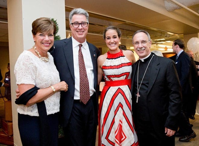 Taking part in the seventh annual fundraiser for Catholic Charities Atlanta are, left to right, Mary Ellen Garrett, Scott Garrett, chair of the CCA board of directors, Anna Garrett, and Bishop Luis R. Zarama, Atlanta auxiliary bishop. Photo By Allison Shirreffs