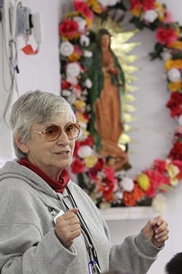 Handmaids of the Sacred Heart of Jesus Sister Margarita Martin leads a debriefing session for the tutors at Oasis Católico Santa Rafaela. Photo By Michael Alexander