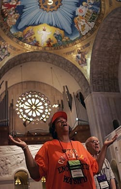 A woman prays during a 2008 Mass for the national encounter of the Cursillo movement at the Basilica of the National Shrine of the Immaculate Conception in Washington. A Cursillo, Spanish for "little course," is a three-day retreat focused on prayer, study and Christian action. CNS photo/Bob Roller