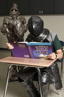 The Pinecrest Academy Paladin mascot, Jack Joiner, catches up on some of the historical occurrences of the modern era. Photo By Michael Alexander