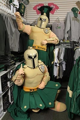 The Blessed Trinity Titan mascots, Christina Georgacopoulos, foreground, and Nicholas Romero, strike a pose in the Titan Spirit Zone, the school store. Photo By Michael Alexander