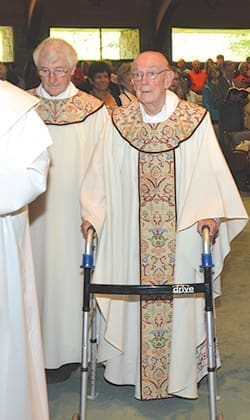 Msgr. R. Donald Kiernan, right, processes from the altar after Mass for the 65th anniversary of his ordination. Held at All Saints Church, Dunwoody, where he was pastor for 25 years, the Mass was concelebrated by pastor Msgr. Hugh Marren, left. Photo By Cindy Connell Palmer